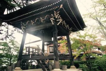 Early autumnal leaves frame ancient shrines