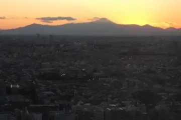 The sun setting somewhere behind Mount Fuji