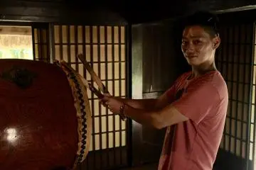 Playing the traditional Hachijo drum