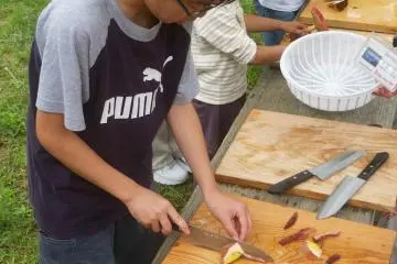 The children were eager to help with mushroom chopping.