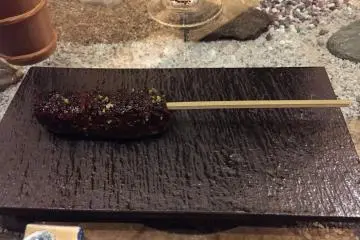 Bear meat on a skewer