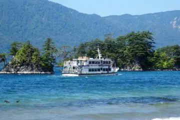 A sightseeing cruise heading across the lake