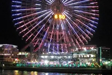 The Cosmo World Ferris Wheel is beautifully illuminated at night