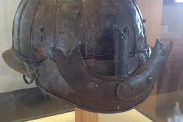 A samurai helmet discovered in the mud during excavations