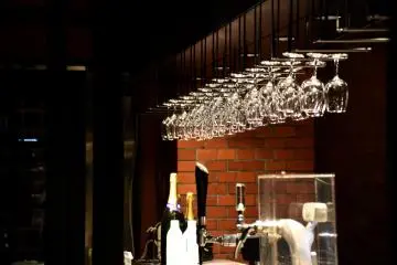 Wine glasses hanging from the ceiling at the counter bar