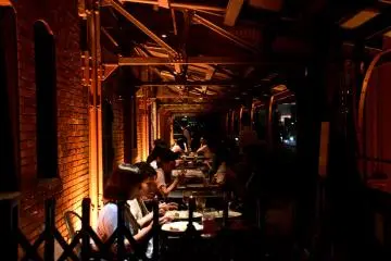 People were enjoying dinner in the open air restaurant