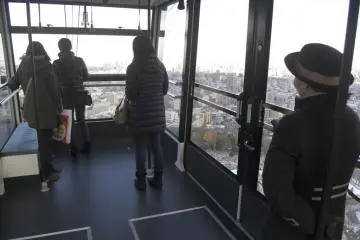 On the way down, passengers move toward the front window for the best view.