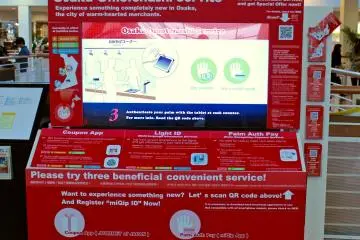 Look for digital signs like this one to get information about the Osaka Omotenashi apps and services and to download the apps.