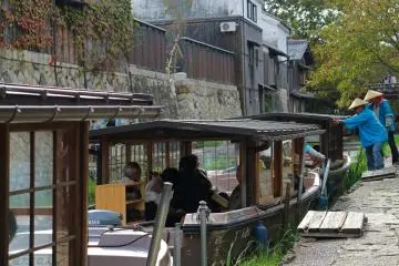 Traditional wooden boats line the canal
