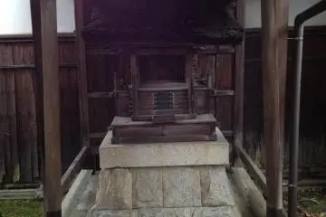 The small family shinto shrine in the back of the garden