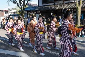 One of the many traditional costumes that children wore with a smile