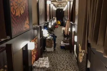 Capsule living, the lockers were small so everyone left their bags out. This place had 24 hr reception staff so I did the same.