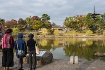 Signs surround the lake with the story in Japanese