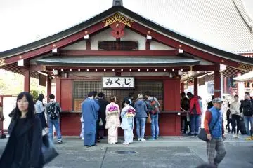 Young boys and girls looking for their omikuji