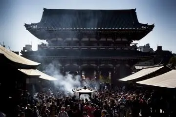 A large incense burner in front of the main hall