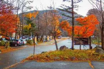 The autumn colors with Mount Oku-Shirane in the distance
