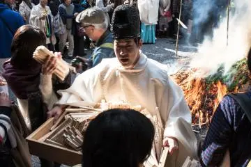 People were allowed to join in and add throw the wooden prayer sticks into the fire