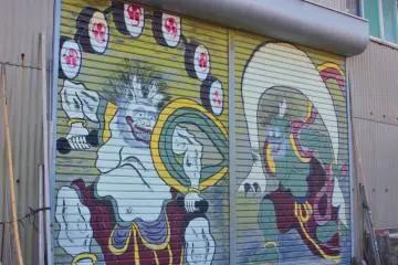 Gods of wind and thunderstorm painted on the shutters of a local shop