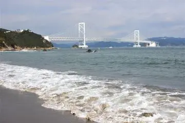 The Naruto Strait and the Onaruto Bridge from the shore. You can see the Aqua Eddy under the bridge.