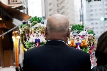 A businessman bought two rakes