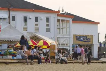 The boardwalk has waterfront strolls as well as fine dining and open-air barbecue spots