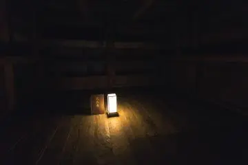 A small lantern lights up a room once used as an armory