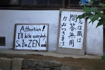 Another sign in the compound says in Japanese, 'The chief priest bites first and asks questions later'!