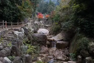The waterfall that follows the path down the trail