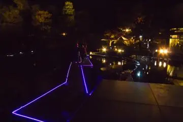 A purple lit pathway to walk over