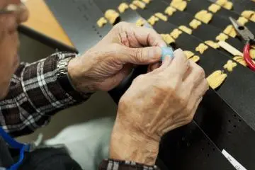 A man working on his Samurai armor