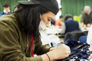 Men working on their Samurai armor