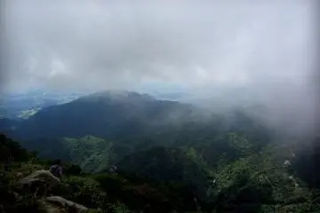 A man peeks under the clouds