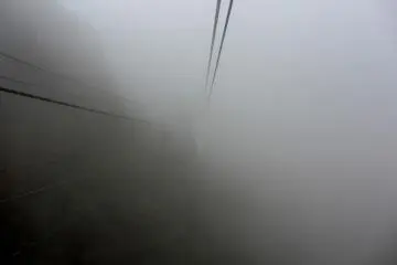 The clouds surround the cable car