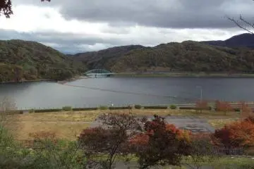 Behind the village is a picturesque view of the river.