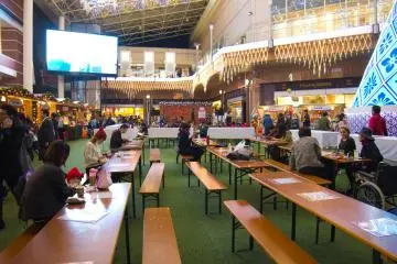 The seating area for people to enjoy the food from the Christmas markets