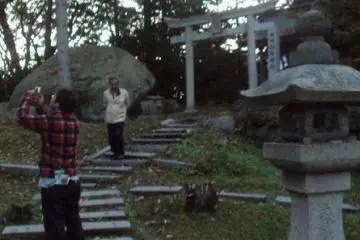 A small garden is behind the shrine.