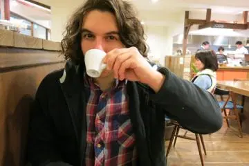 Me drinking an espresso.