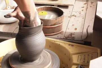 An artisan creates beautiful work before my eyes