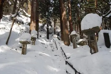 One can just make out the stone steps underneath the snow masses