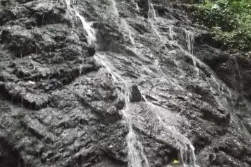 The water cascades gently down this rock face