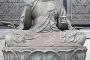 A Buddhist statue in the graveyard
