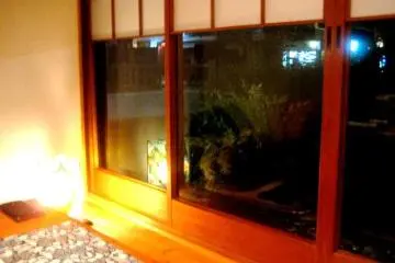 Private dining room with wood decor and view of the Takasegawa canal in Kiyomachi south of Shijo Kyoto