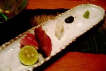 Succulent Duck breast served with three sauces including black garlic and wasabi at the Private dining room with wood decor and view of the Takasegawa canal in Kiyomachi south of Shijo Kyoto