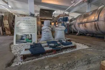 A display inside the jeans museum. The machines on the right are for washing the jeans.