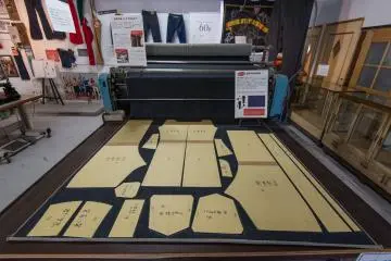 A display at the museum showing how denim is cut to create jeans.