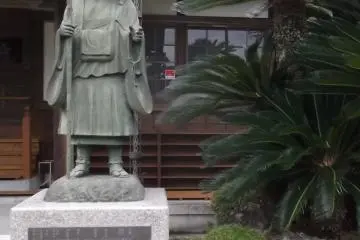 A pilgrim by the temple buildings