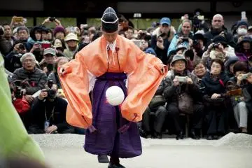 Players are dressed in colourful traditional court costumes
