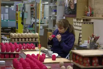Kokeshi doll artist at work