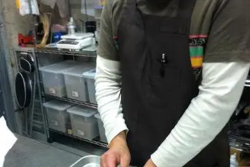 The master prepares a meaty wrap sandwich