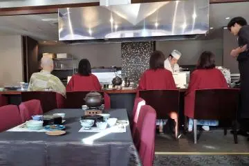 Request seats overlooking the kitchen